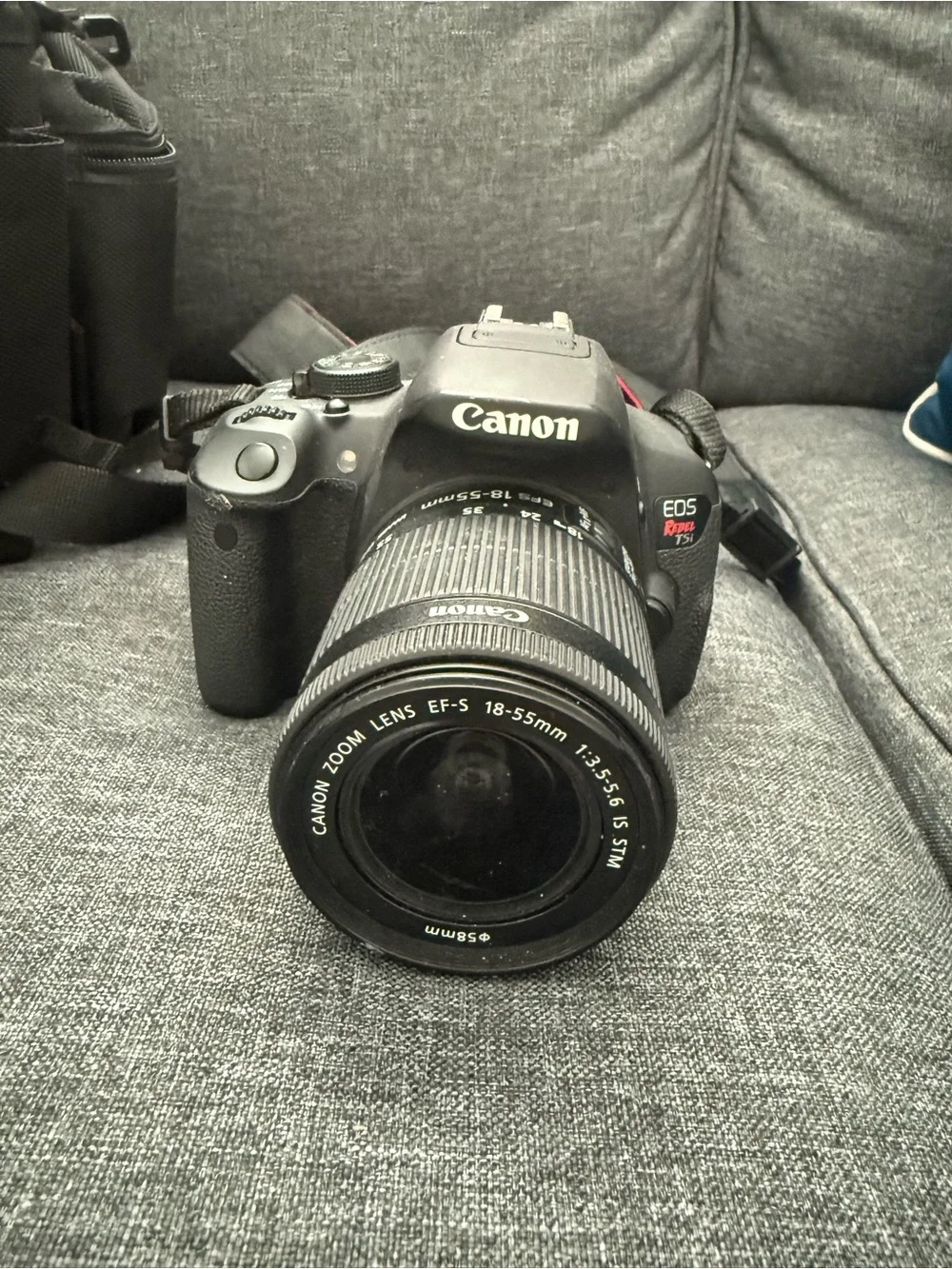 Canon Black DSLR with Two Interchangeable Lenses and Canon Rebel Bag